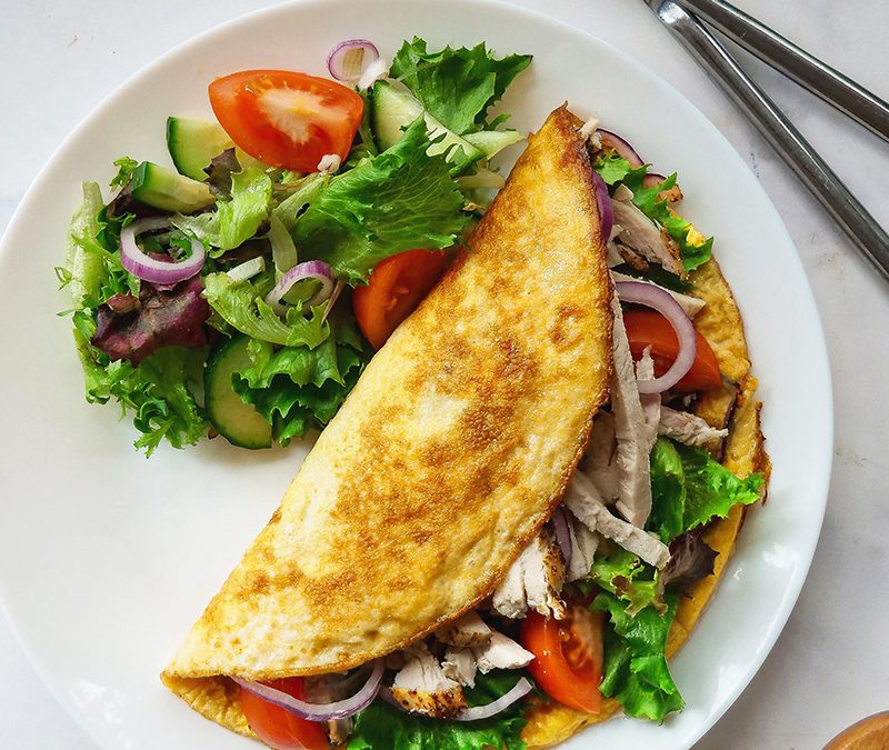 Chicken and red onion omelette with salad